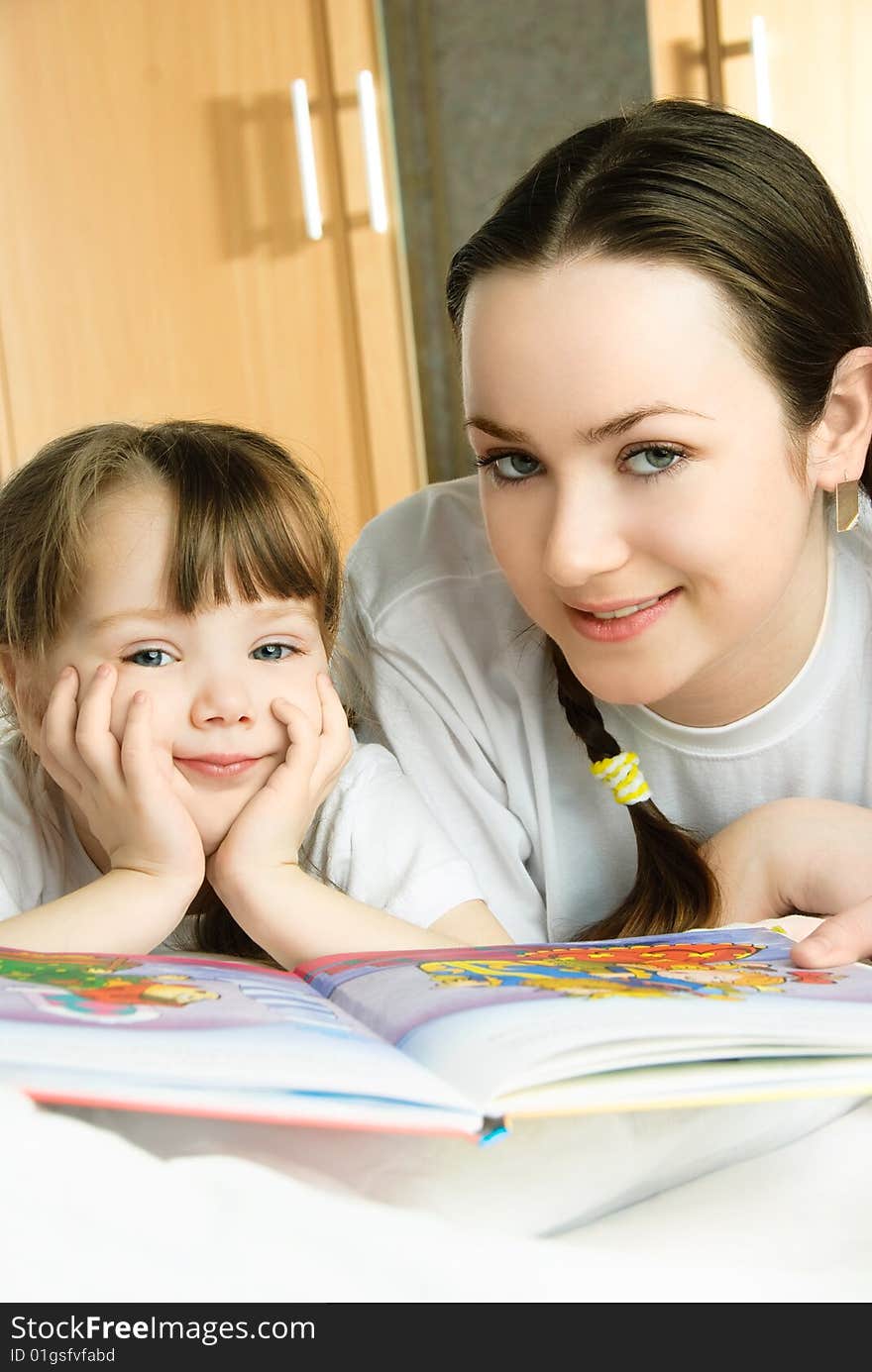 Mother And Daughter Reading A Book