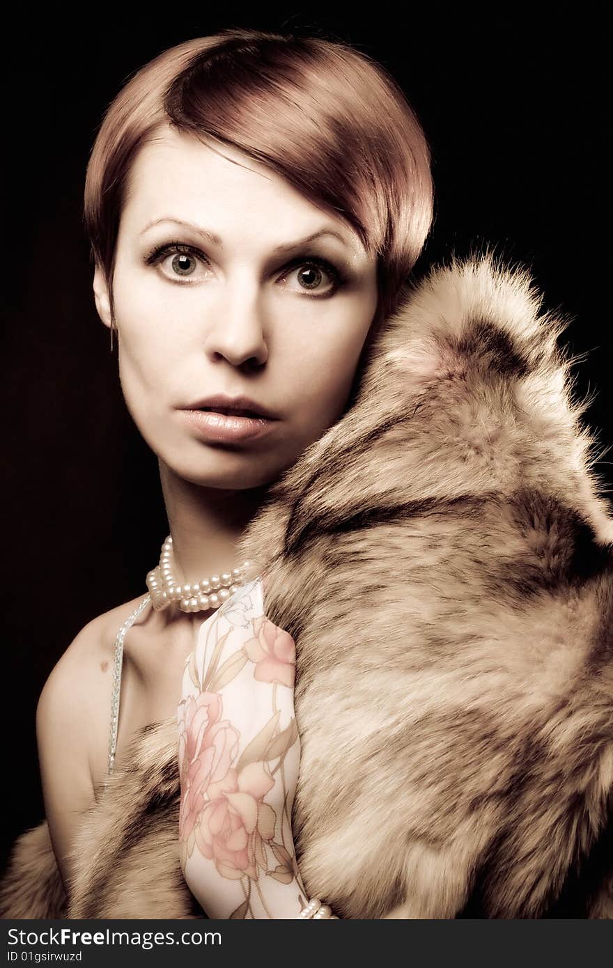 Glamour girl in a retro style against a dark background. Glamour girl in a retro style against a dark background