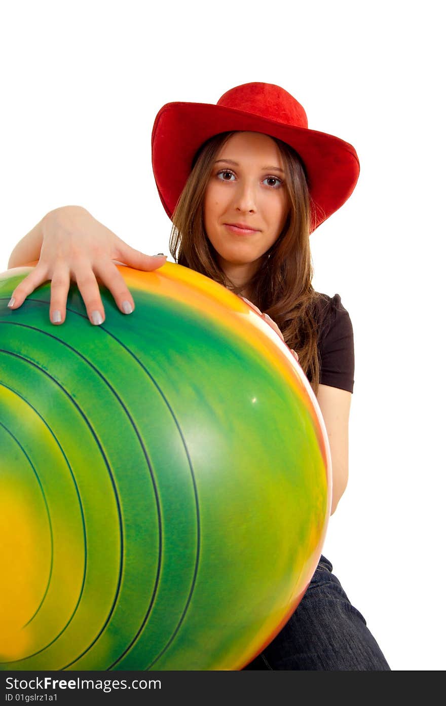 Girl in a western hat with a large ball. Girl in a western hat with a large ball