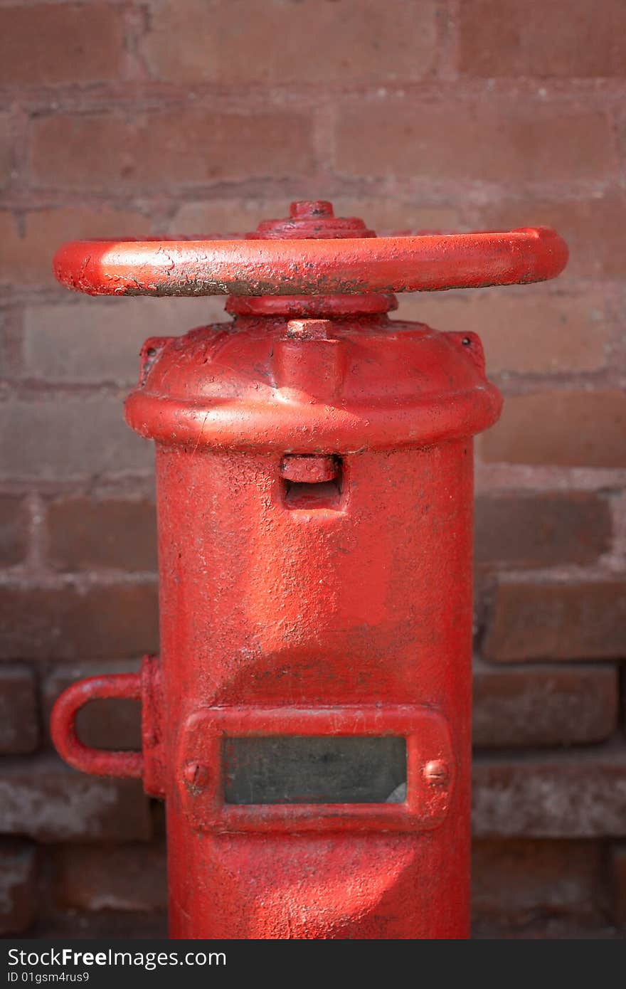 Closeup of red water pipe plumbing valve