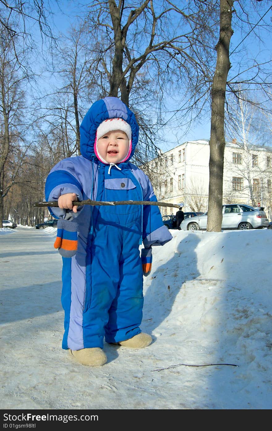 Kid playing in the park in winter