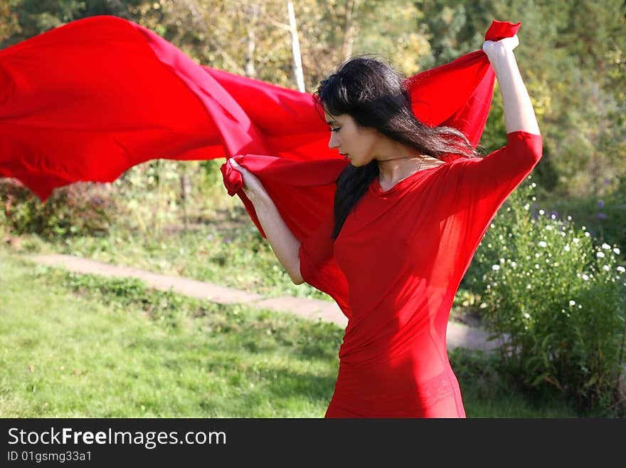 Girl in red dress outdoors