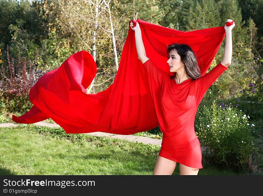 Lovely girl red dress and flapping. Lovely girl red dress and flapping