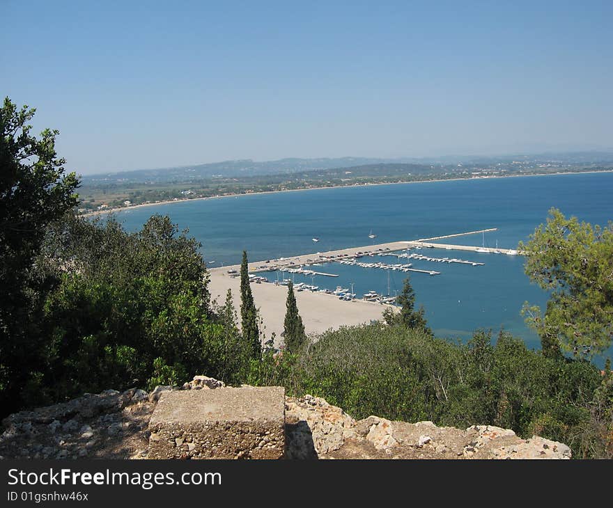 A marina in Greece as seen from the top of a hill. A marina in Greece as seen from the top of a hill.