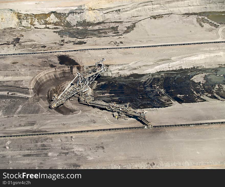 Large excavator in coal mine, aerial view. Large excavator in coal mine, aerial view