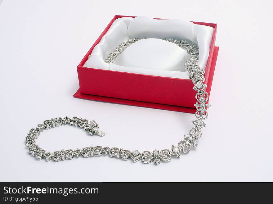 White gold necklace in a red box