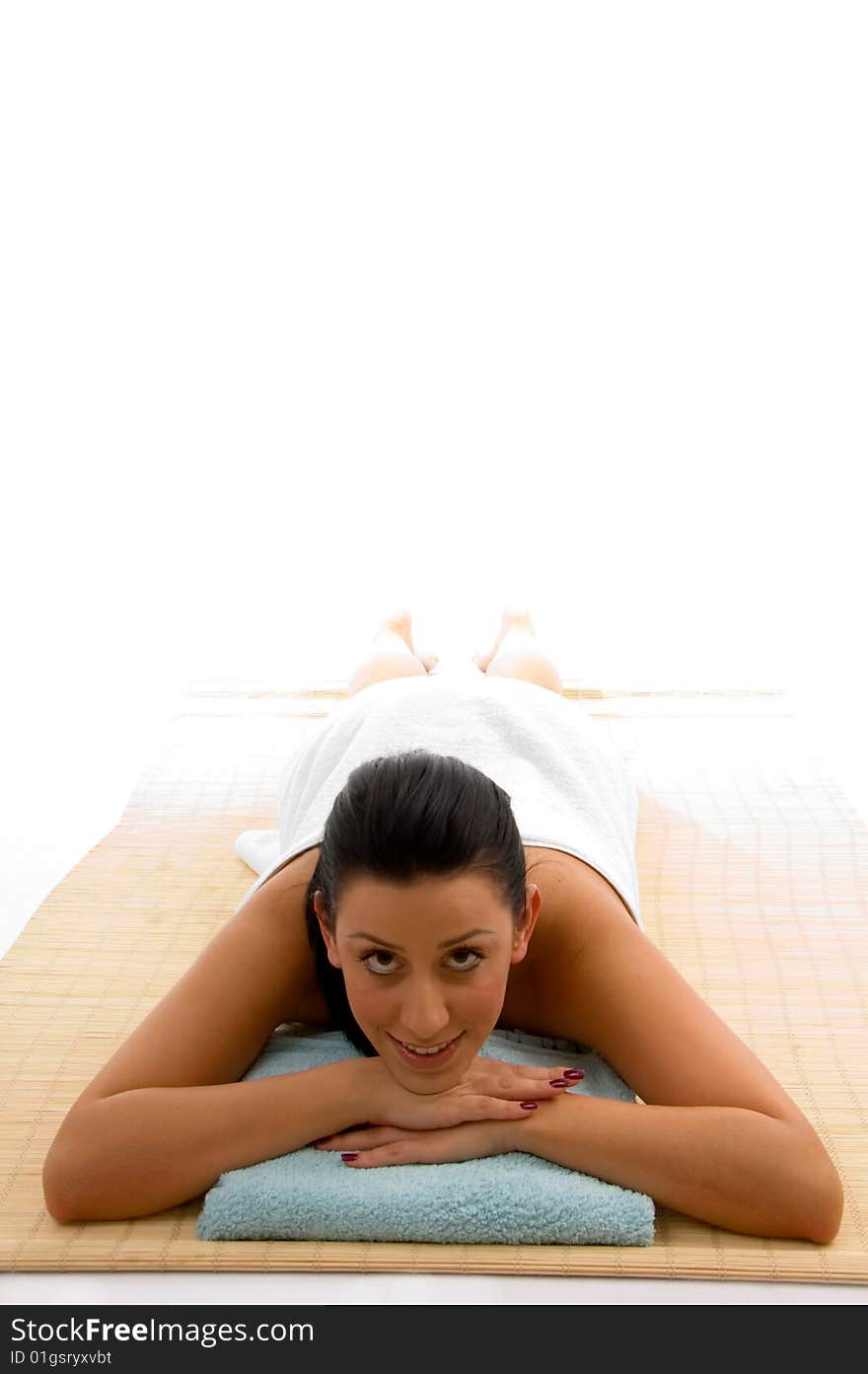 Top view of smiling young woman scrubbing her body against white background. Top view of smiling young woman scrubbing her body against white background