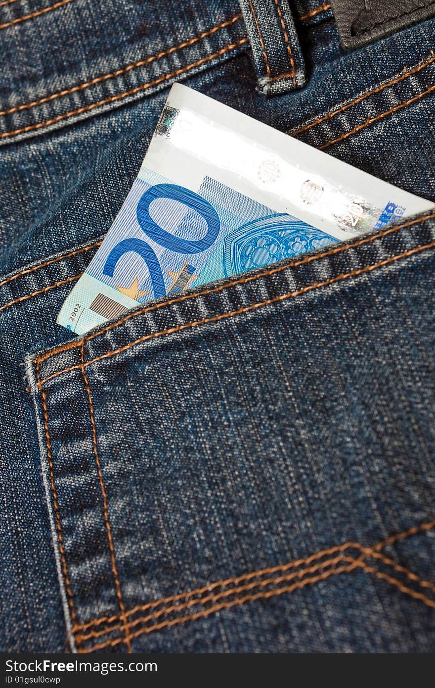 Blue denim jeans with a twenty euro note in the pocket