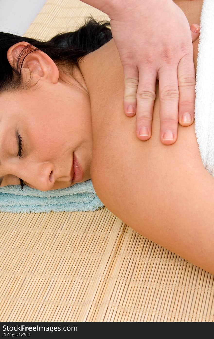 Smiling woman scrubbing her body