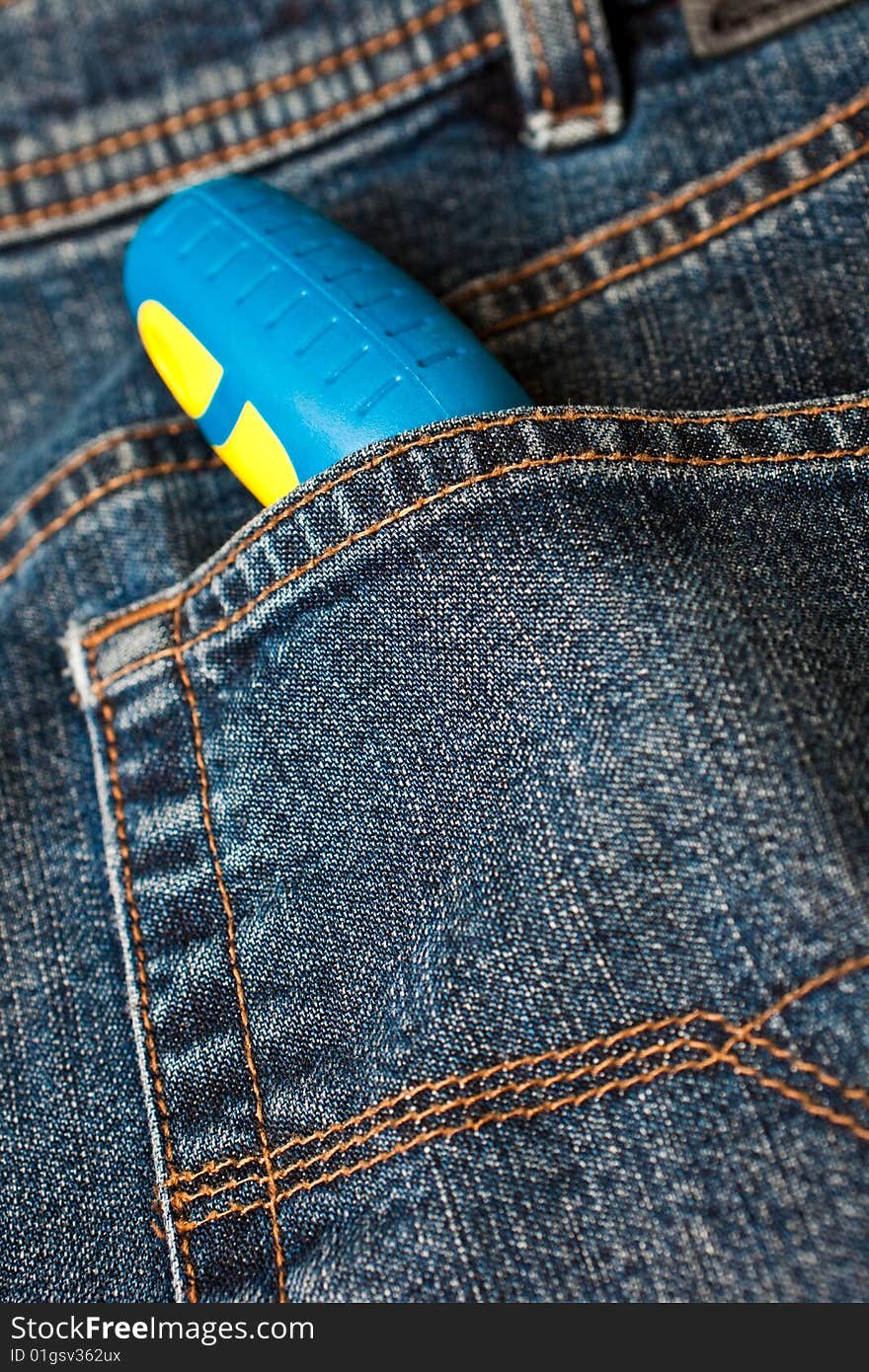 Blue Denim Jeans With A Screw Driver In The Pocket