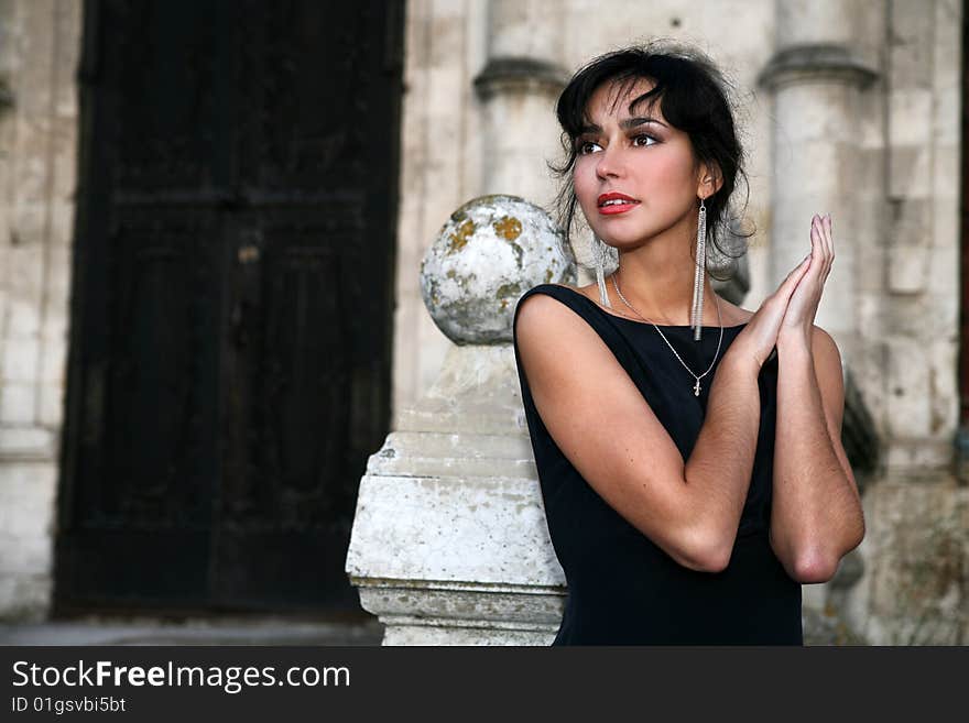 Lovely brunette beside old house. Lovely brunette beside old house