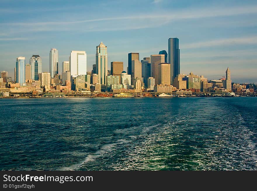 The Seattle, Washington skyline from a ferry boat in the Puget Sound, on a bright, sunny day. The Seattle, Washington skyline from a ferry boat in the Puget Sound, on a bright, sunny day.