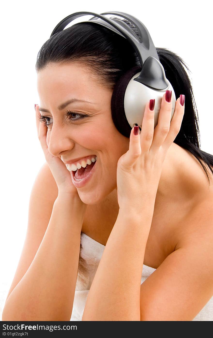 Front view of smiling woman enjoying music on an isolated white background. Front view of smiling woman enjoying music on an isolated white background