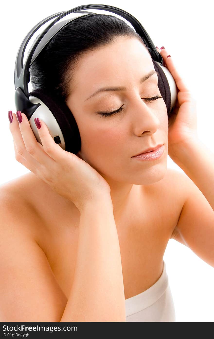 Top view of young female enjoying music with white background. Top view of young female enjoying music with white background