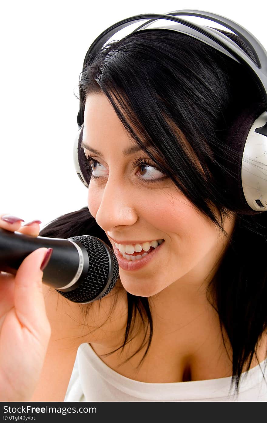 Top view of young woman with headphone and microphone on white background