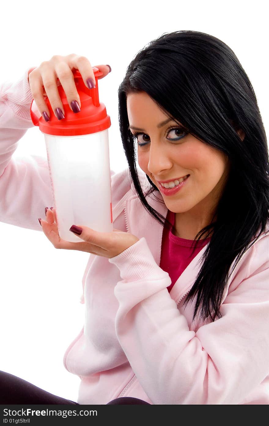 Front view of smiling female holding water bottle with white background. Front view of smiling female holding water bottle with white background