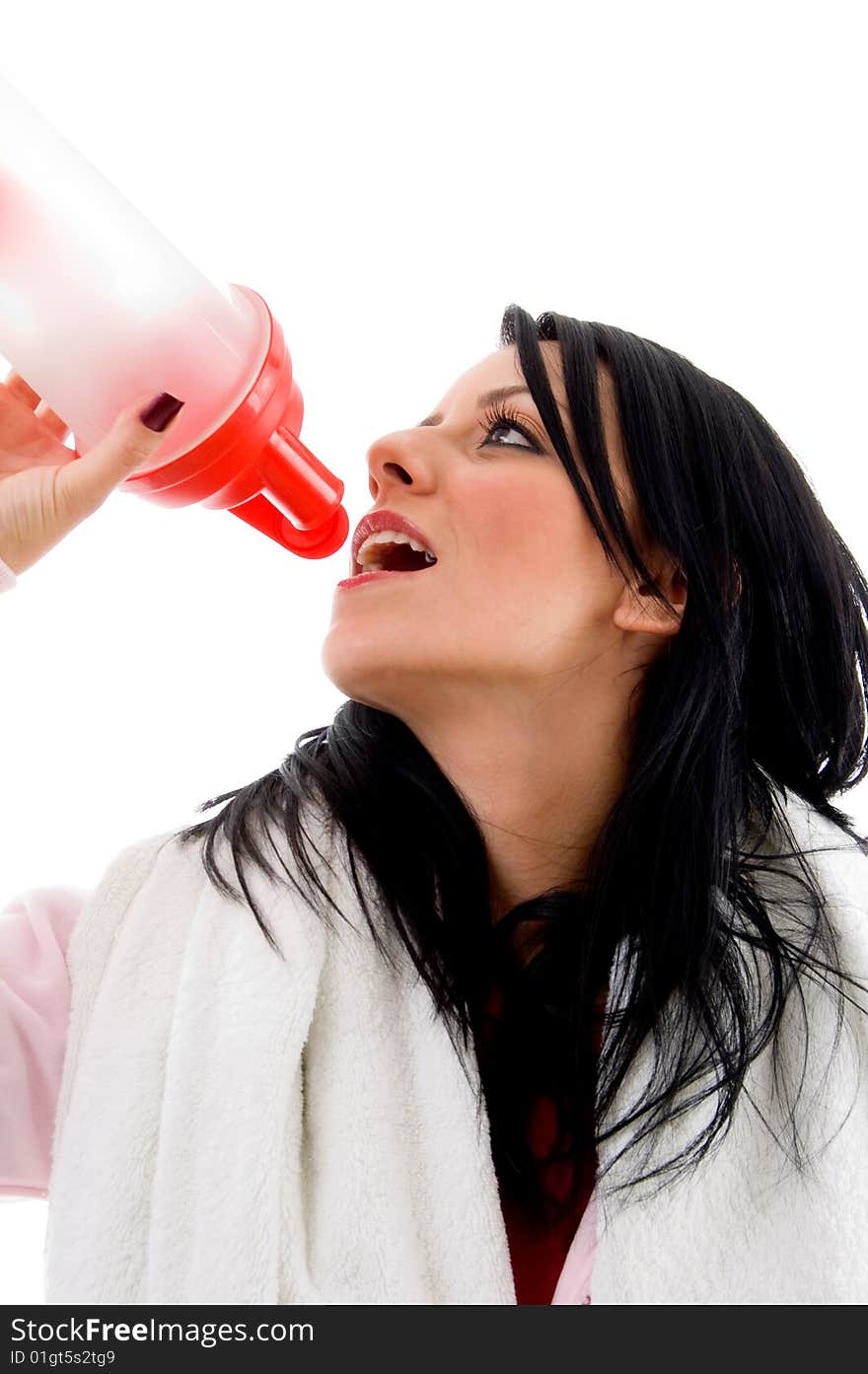 Portrait of woman taking refreshment against white background