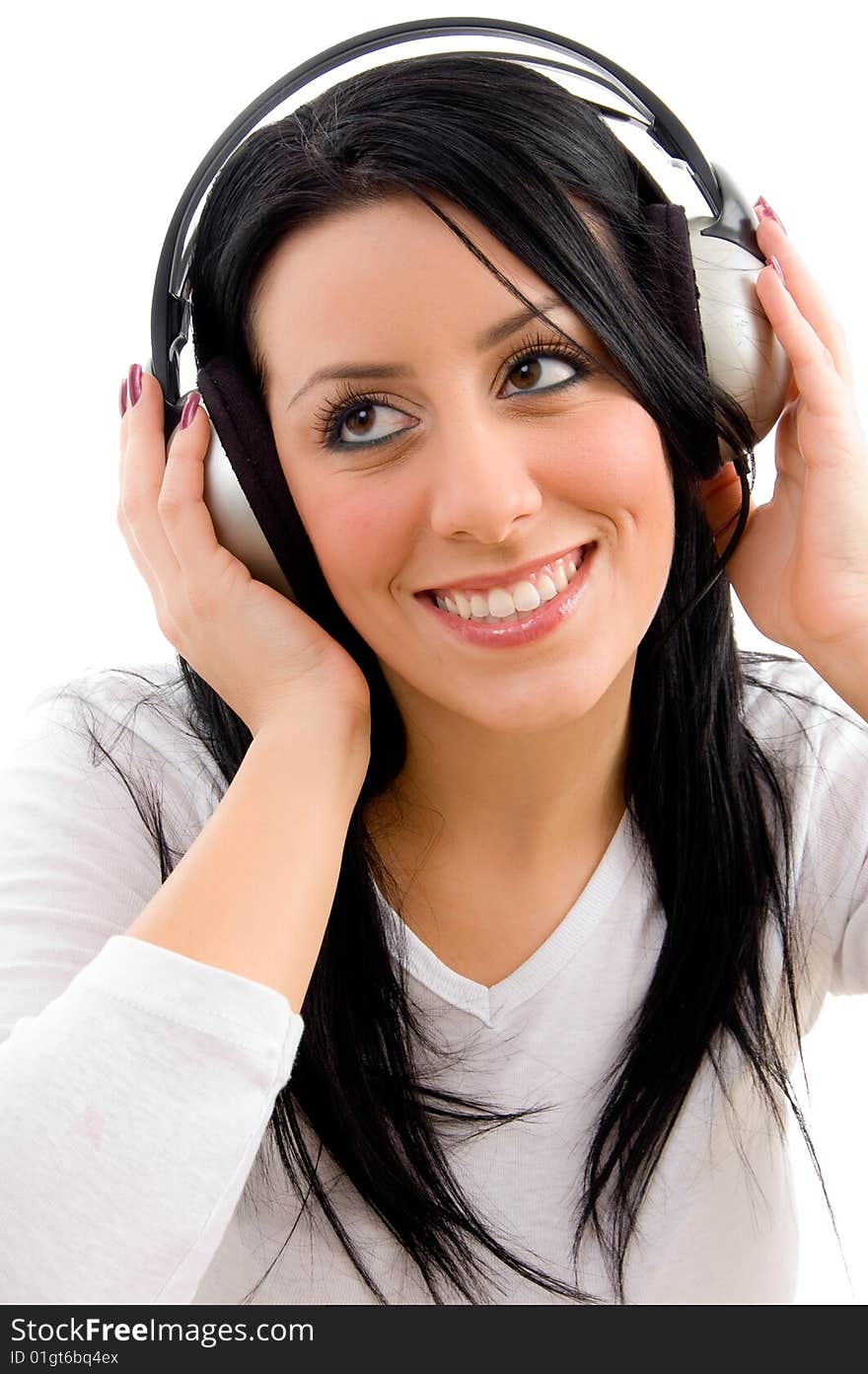 Front view of happy model listening music