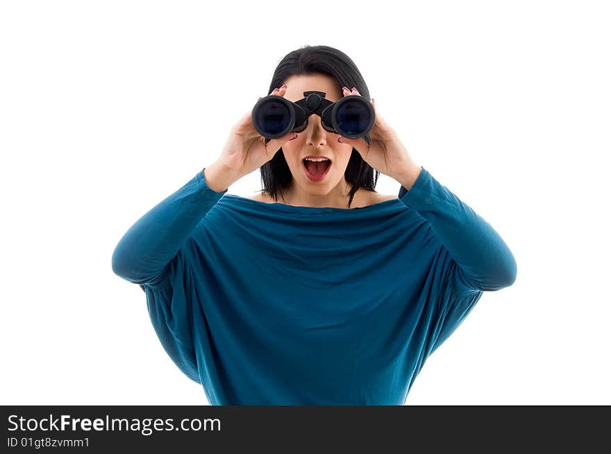 Portrait of female looking through binocular against white background