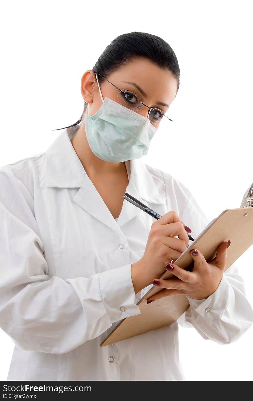 Doctor with writing pad and mask on white