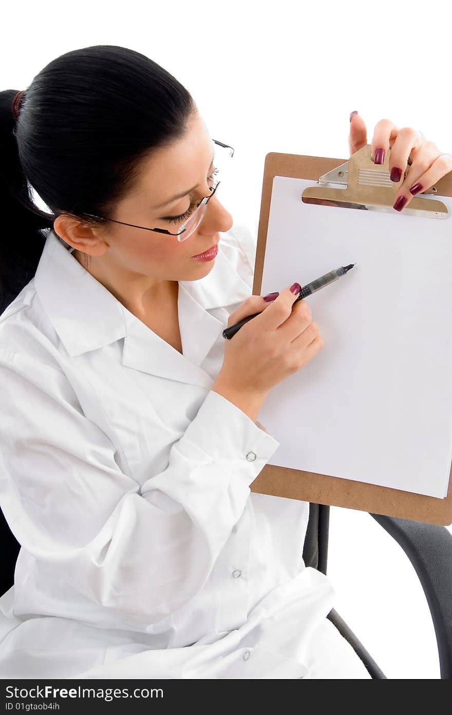 Female doctor indicating writing pad