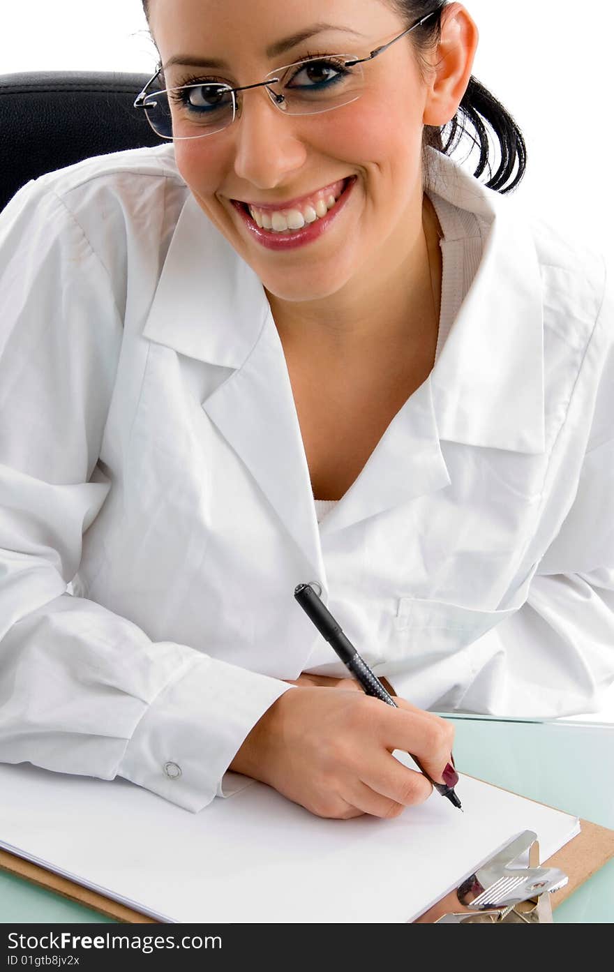 Front view of smiling female doctor looking at camera