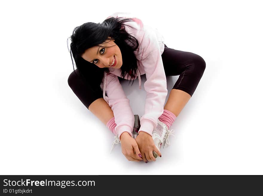 High angle view of female doing exercise on an isolated background. High angle view of female doing exercise on an isolated background