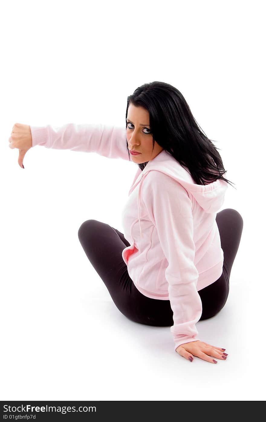 Back pose of model with thumbs down on an isolated white background