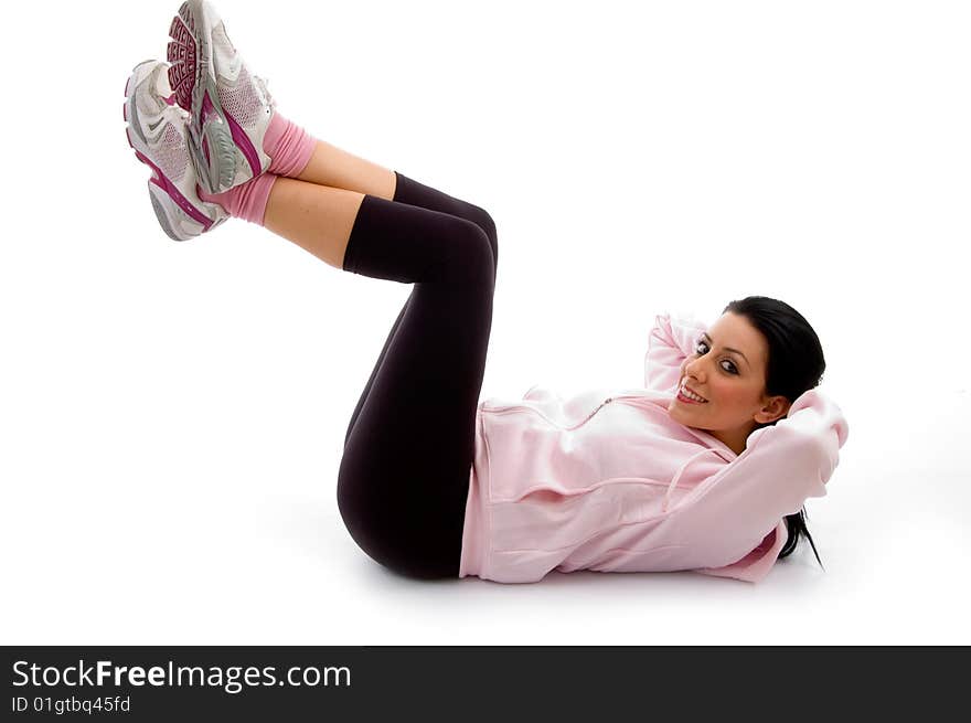 Side view of smiling exercising female on an isolated background. Side view of smiling exercising female on an isolated background