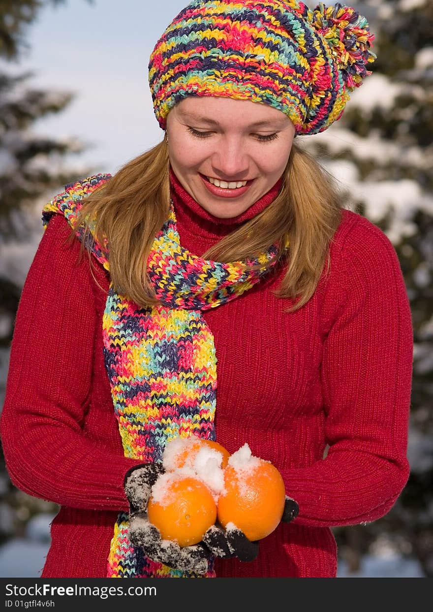 Smiling girl and oranges