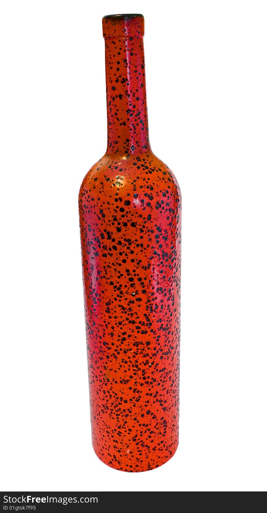 The red glass bottle with black specks on a white background. The red glass bottle with black specks on a white background