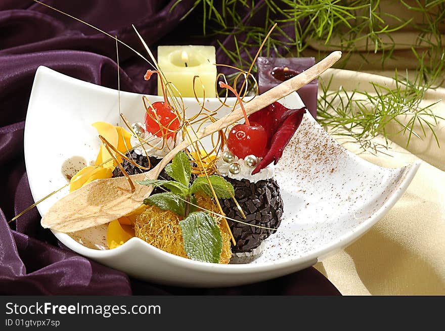 Chocolate dessert, decorated saccharine fruit