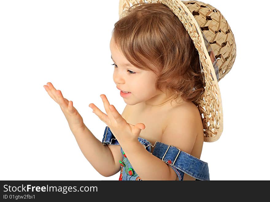 A little girl is in a straw hat. A little girl is in a straw hat.