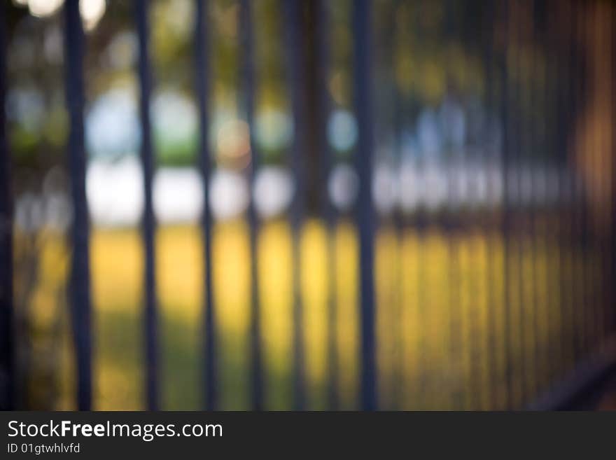 Abstract image of a wrought iron fence in warm sunlight. Abstract image of a wrought iron fence in warm sunlight