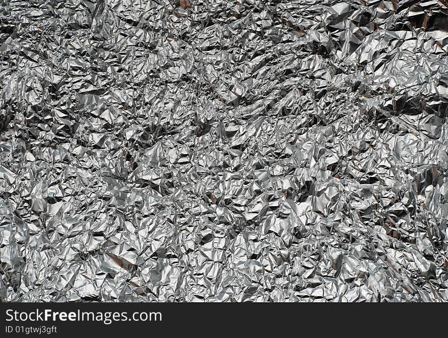 Background with rumpled aluminium foil