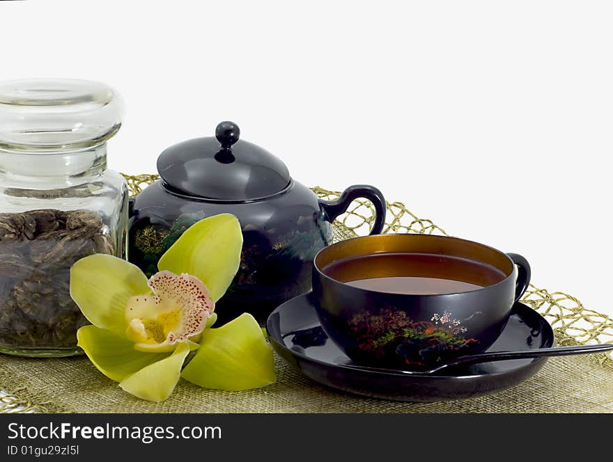 Green tea in a bright cup on a white background. Green tea in a bright cup on a white background