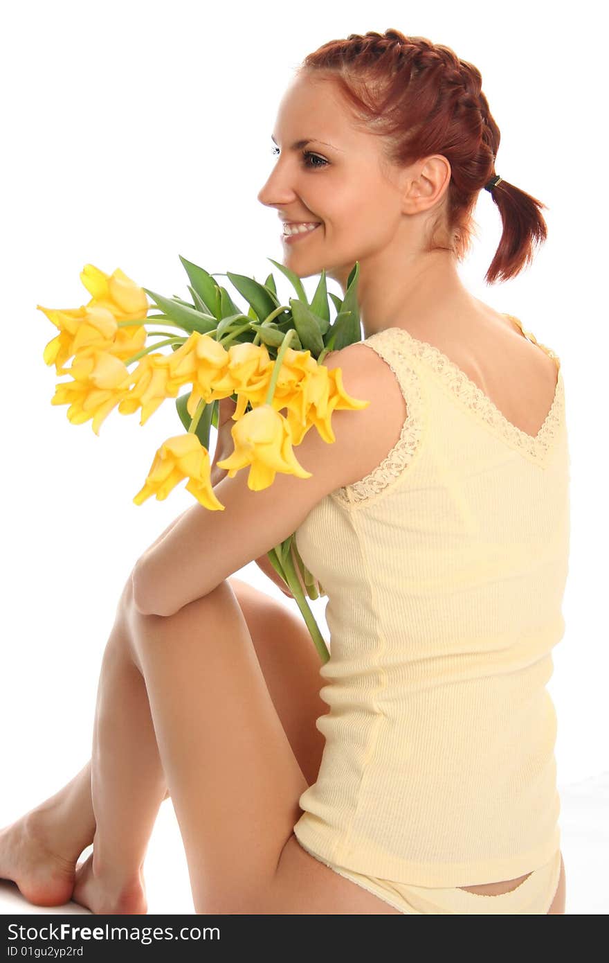 Cute young woman with yellow tulips. Cute young woman with yellow tulips