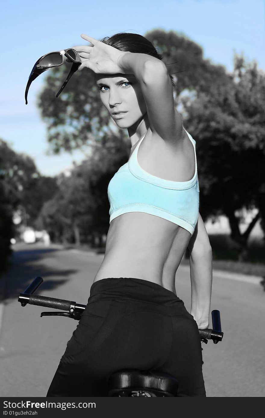 Slim girl on bicycle outdoors. Slim girl on bicycle outdoors