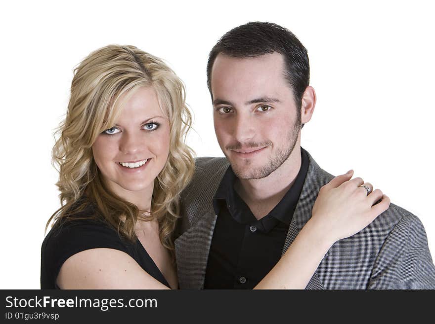 Couple with arms around each other smiling at the camera, isolated on white background. Couple with arms around each other smiling at the camera, isolated on white background.