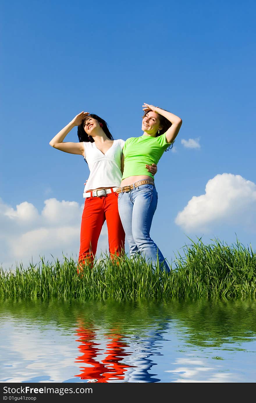 Two happy young women dreams to fly on winds