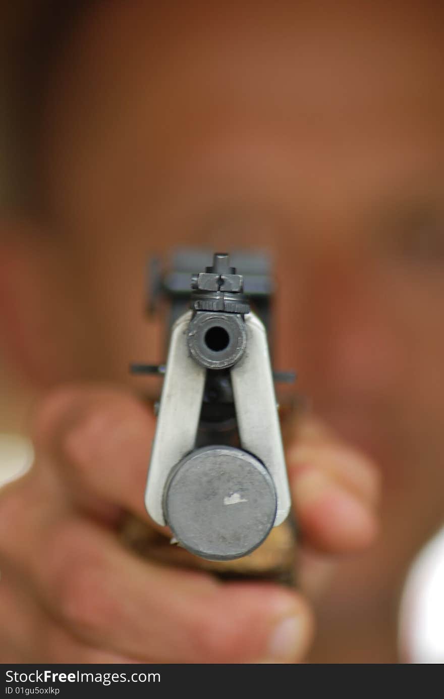 Close up of an aiming  pistol