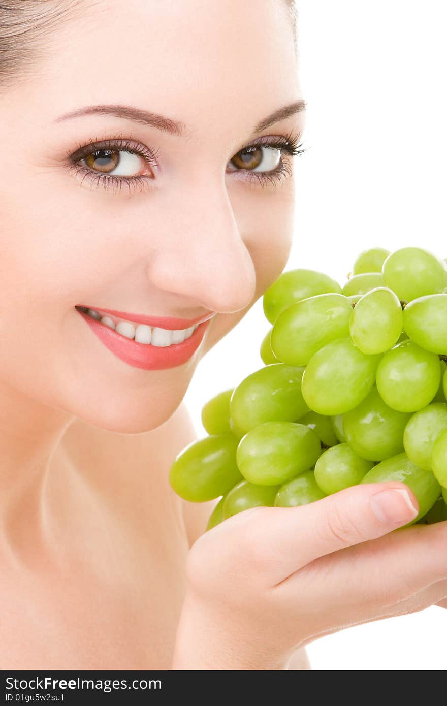 Pretty woman with green grape isolated on the white background