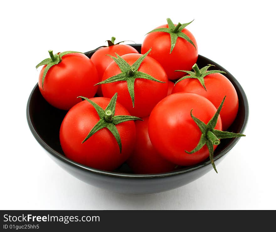 Tomatoes in a black bowl. Tomatoes in a black bowl