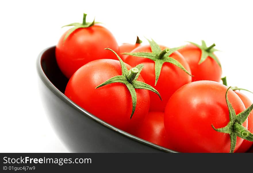 Tomatoes in a black bowl. Tomatoes in a black bowl