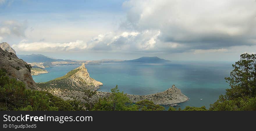 Mountain cape in background of sea