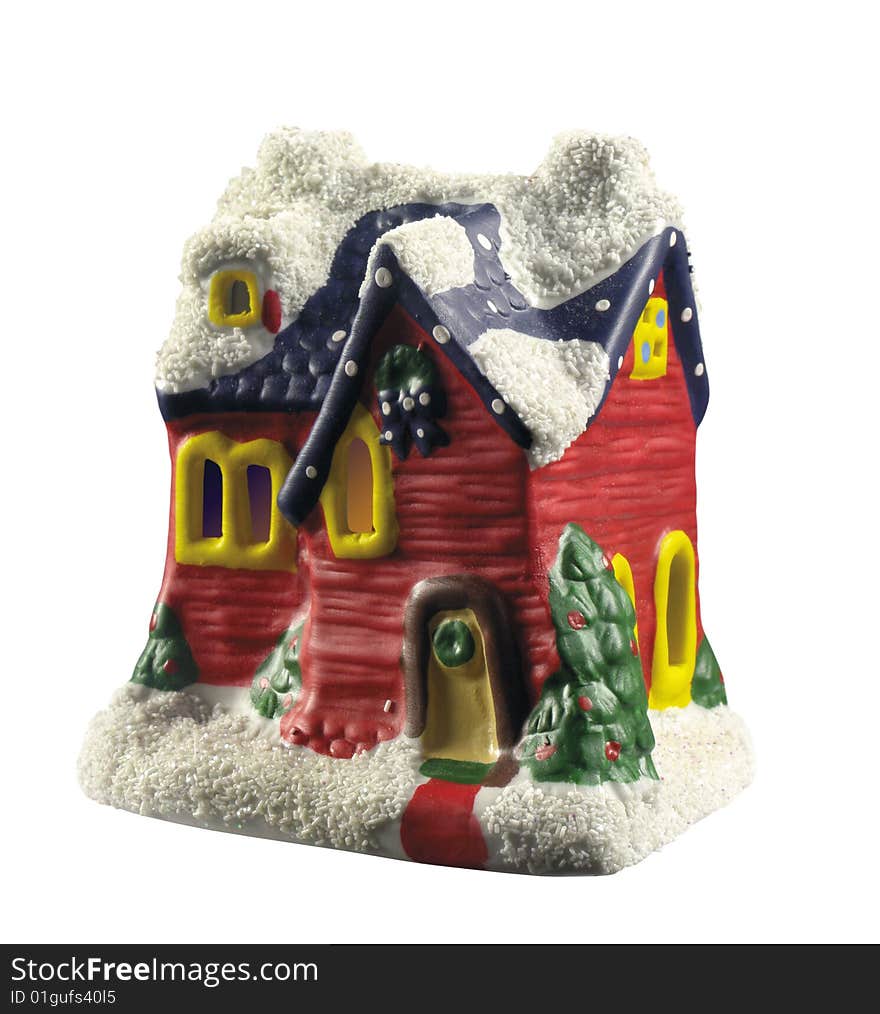 a little toy house with snow on the roof. a little toy house with snow on the roof