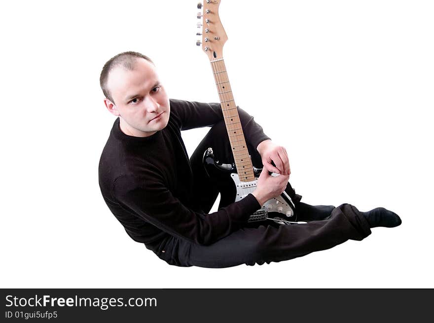 Musician with guitar isolated on white