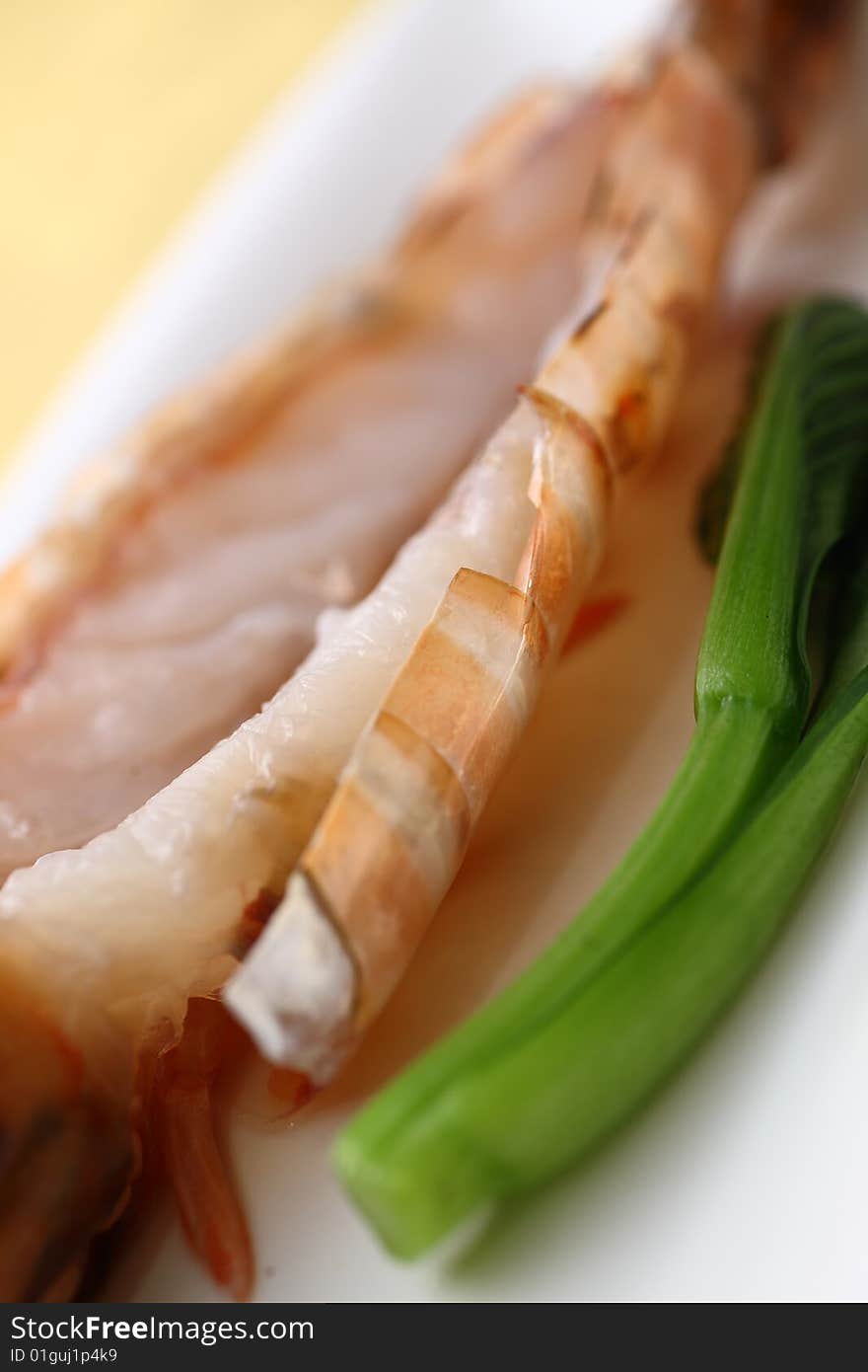 Shrimp and asparagus in a white plate