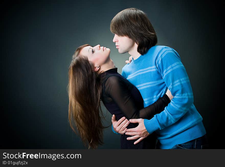 Young lovely couple, studio shot