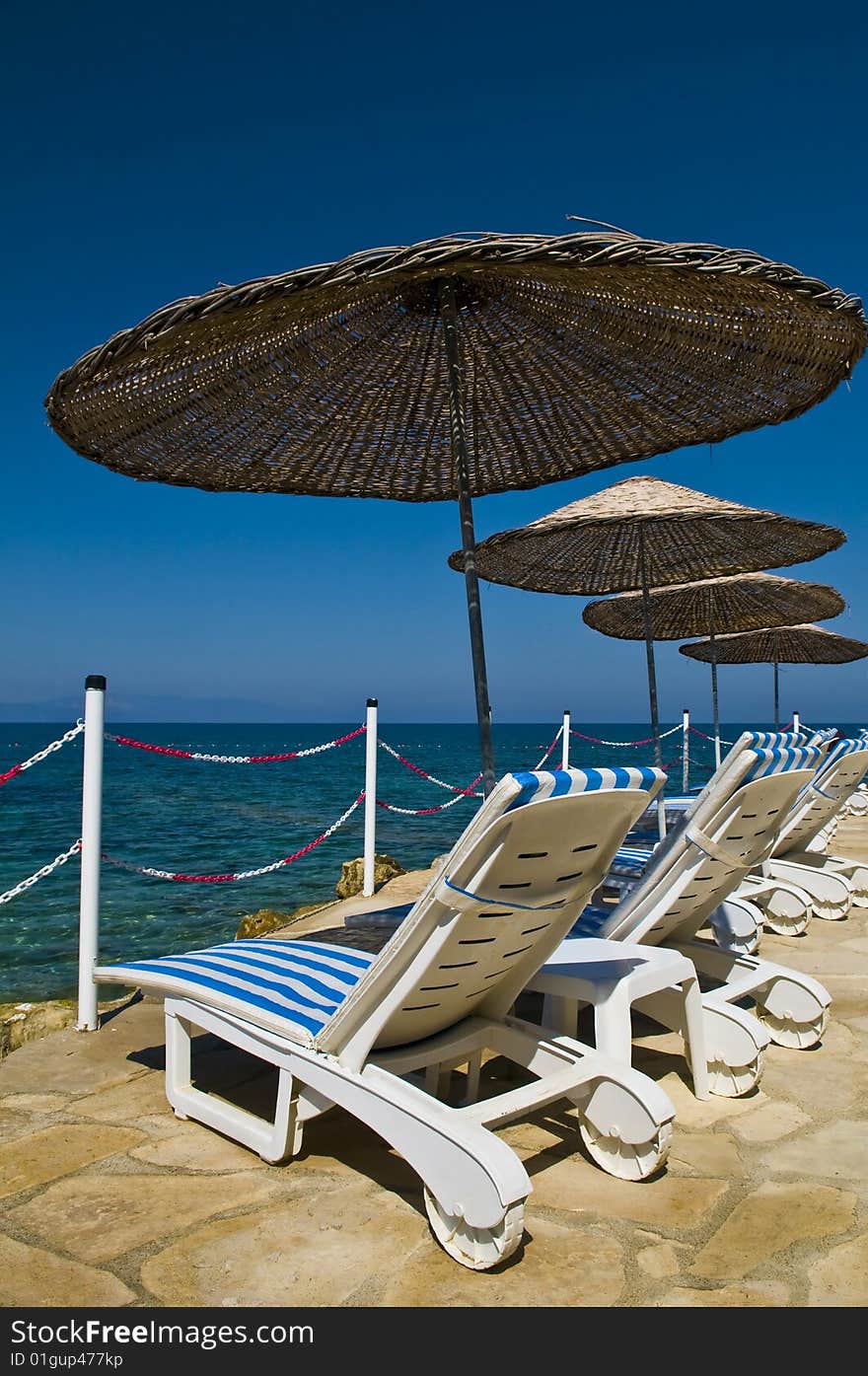 Sunshades in Turkish resort in the Aegean sea